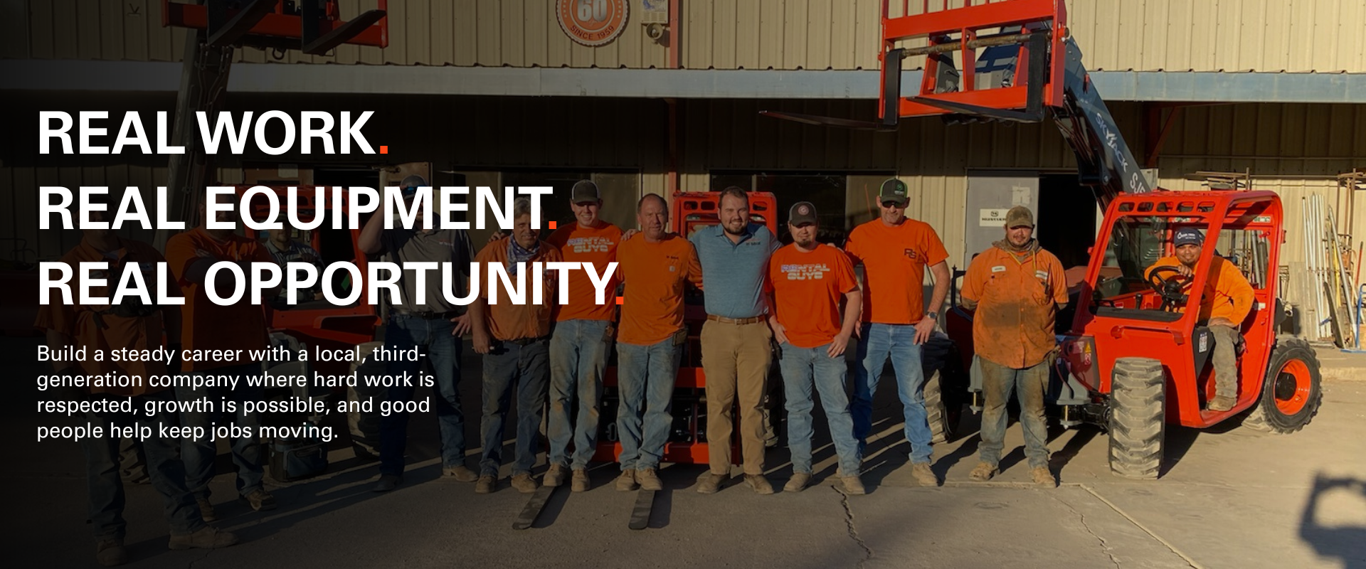Rental Guys employees standing with equipment outside a Rental Guys branch